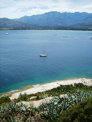 Corsica offers a yacht charter paradise - pristine beaches, mountainous backdrops, beautiful turquoise water calvi